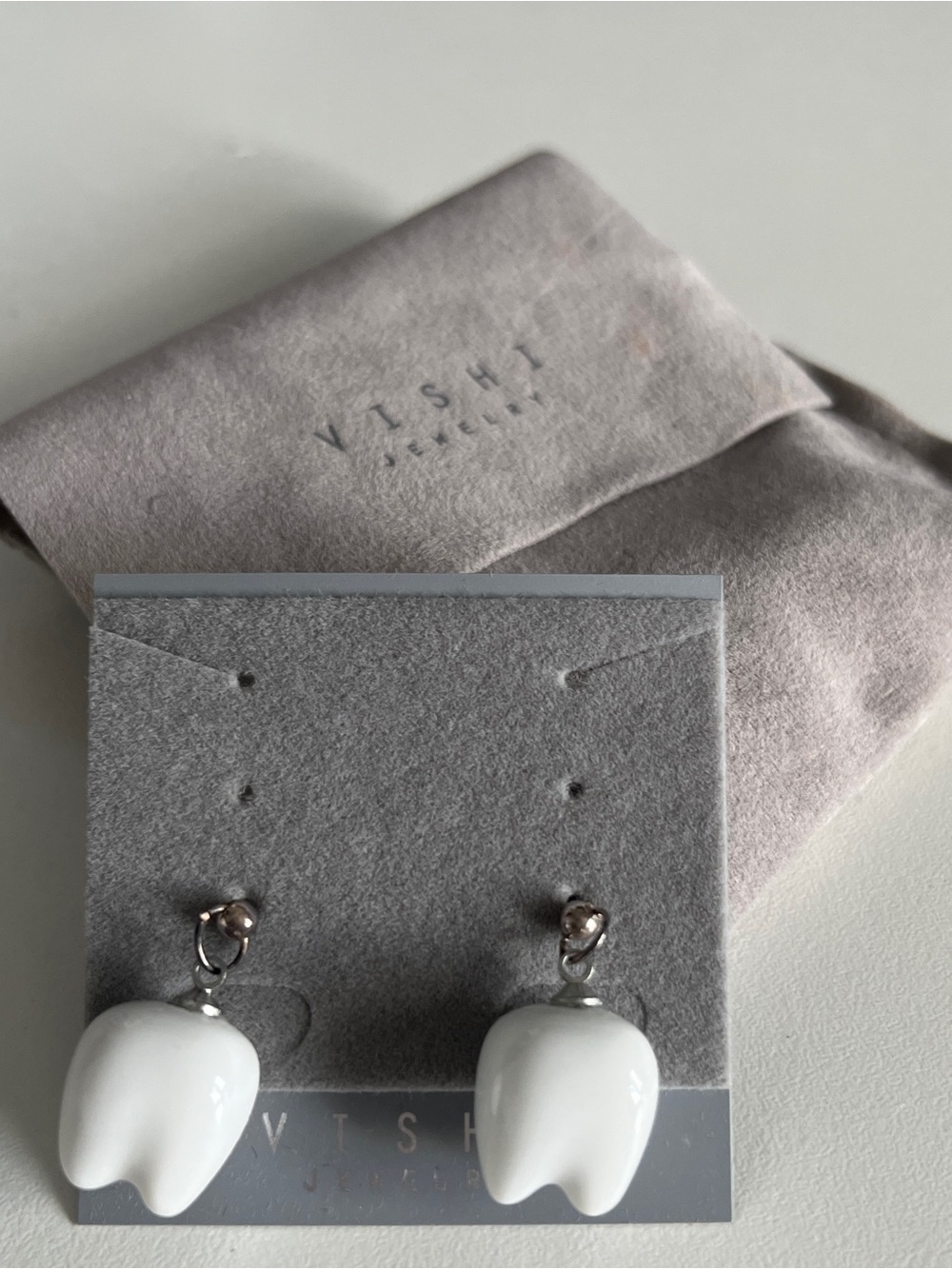 Brand new Vashi jewelry tooth-shaped ceramic stud earrings